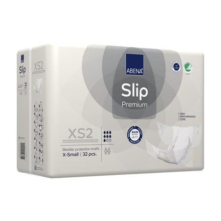 Ein Packung Abena Slip Premium in der Größe XS2 ist auf diesem Bild abgebildet. Die Verpackung ist in einem hellblauen Design gehalten und zeigt das Produkt-Logo sowie klare Informationen zur Größe und Saugstärke. Auf der Vorderseite sind Bilder von den Windelslips sowie zusätzliche Angaben zur Verwendung. Die Verpackung ist versiegelt und erweckt den Eindruck von hoher Qualität. Diese Einweg-Windelslips sind für Inkontinenzpatienten gedacht und bieten Schutz sowie Komfort.