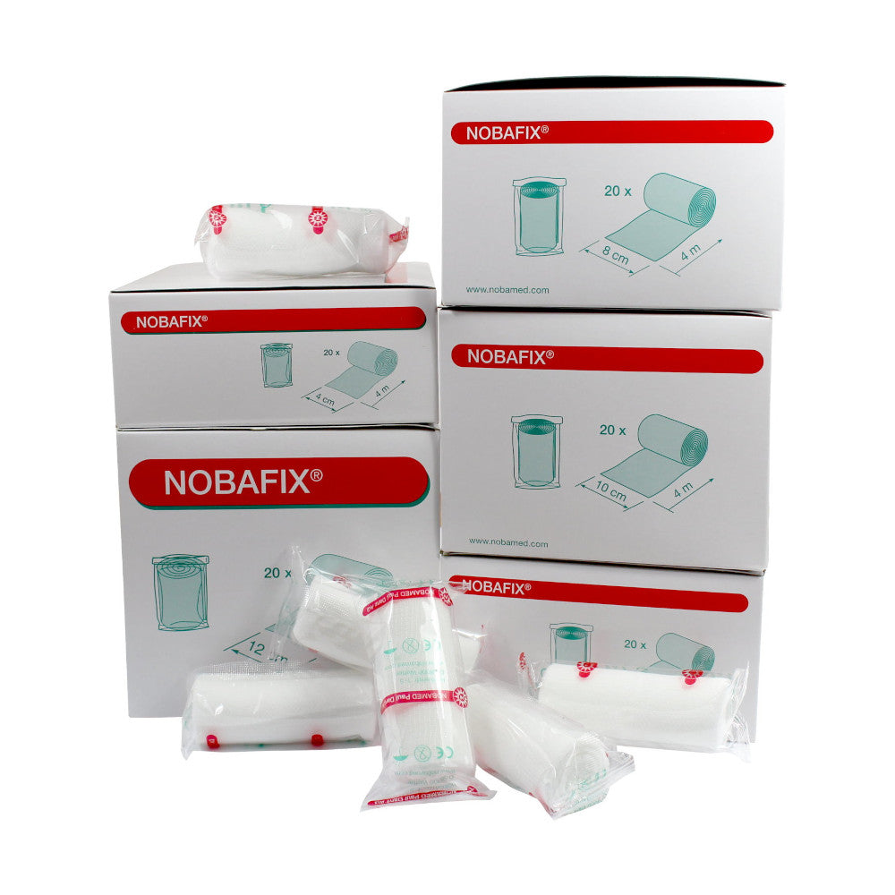 Bild zeigt eine Übersicht von hochwertigen Fixierbinden in verschiedenen Farben und Größen, die in einer transparenten Kunststoffverpackung präsentiert sind. Die Binden sind sauber verpackt und ordentlich angeordnet, wobei jede Binde eine spezifische Farbe aufweist, darunter Blau, Rot, Gelb und Grün. Die Verpackung hebt die vielseitige Verwendbarkeit und die hohe Qualität der Produkte hervor.