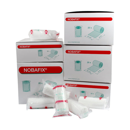 Bild zeigt eine Übersicht von hochwertigen Fixierbinden in verschiedenen Farben und Größen, die in einer transparenten Kunststoffverpackung präsentiert sind. Die Binden sind sauber verpackt und ordentlich angeordnet, wobei jede Binde eine spezifische Farbe aufweist, darunter Blau, Rot, Gelb und Grün. Die Verpackung hebt die vielseitige Verwendbarkeit und die hohe Qualität der Produkte hervor.