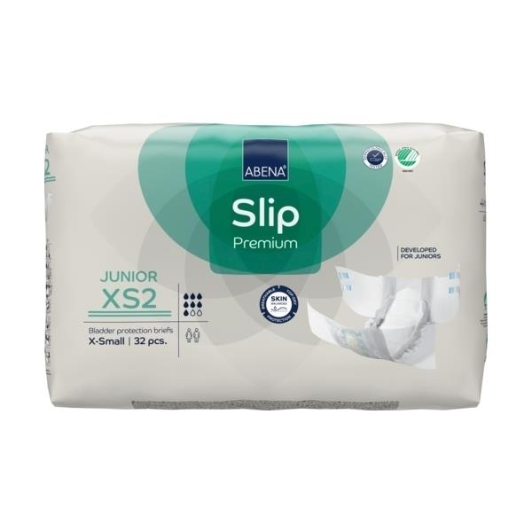 Das Bild zeigt eine Packung mit Abena Slip Premium Junior XS2, einem Inkontinenzprodukt für Kinder. Die Verpackung ist überwiegend in Weiß und Blau gehalten, mit bunten Illustrationen, die Fröhlichkeit und Aktivität ausstrahlen. Auf der Vorderseite sind die Produktbezeichnung, die Größe XS2 und Hinweise zur Saugfähigkeit gut sichtbar. Der Hintergrund enthält visuelle Elemente, die auf die Eignung für Kinder hinweisen, einschließlich spielerischer Motive.