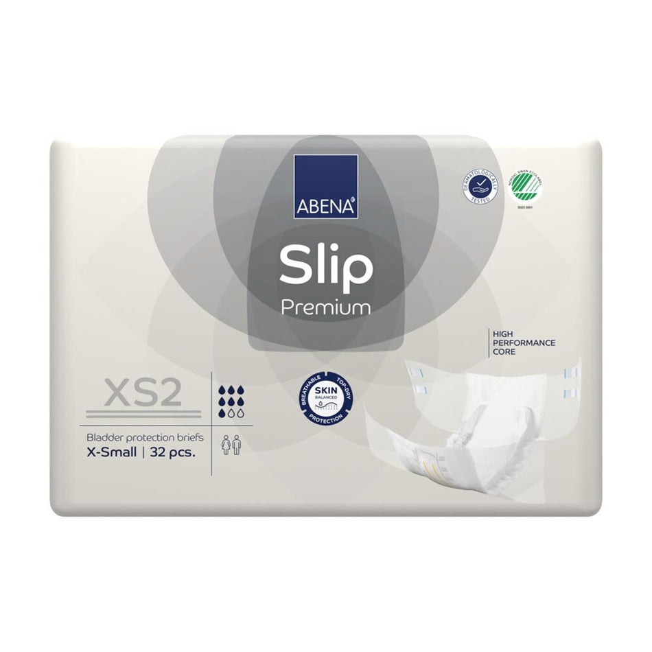 Abena Slip Premium XS2 in einer packungs- und produktorientierten Darstellung. Das Bild zeigt die Windel in einer weißen und blauen Farbgestaltung, mit einer leicht glänzenden Oberfläche und mehreren detaillierten Grafiken, die die wichtigsten Eigenschaften hervorheben. Die Windel ist geöffnet und liegt flach auf einem neutralen Hintergrund, um ihre Form und Struktur zu verdeutlichen. Die abgebildete Größe ist für sehr kleine Körpergrößen geeignet.